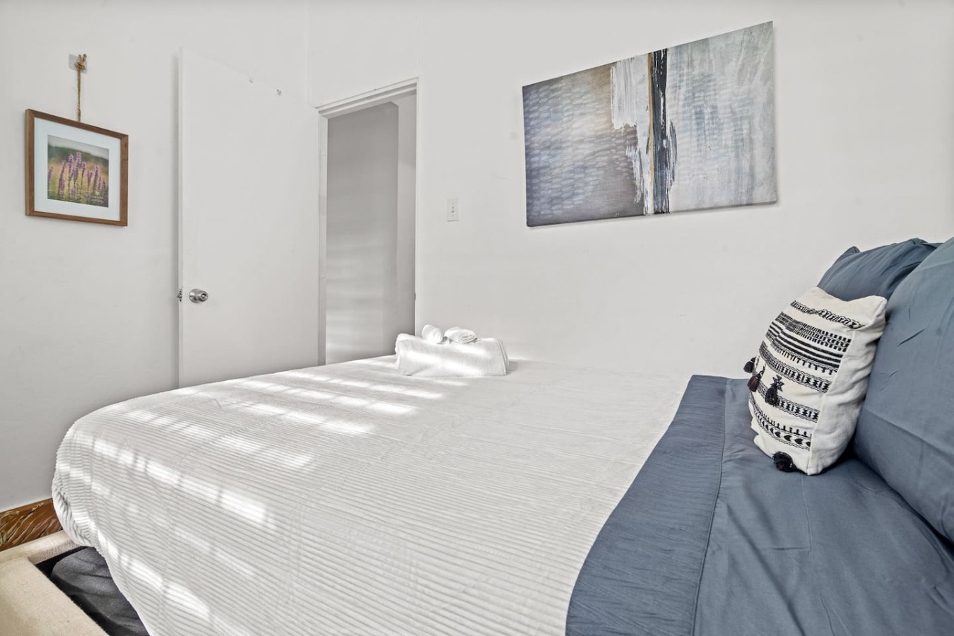 Bedroom with a white bedspread and a blue blanket — Sunkiss in puerto Rico San Juan 3 Bedroom, Santurce