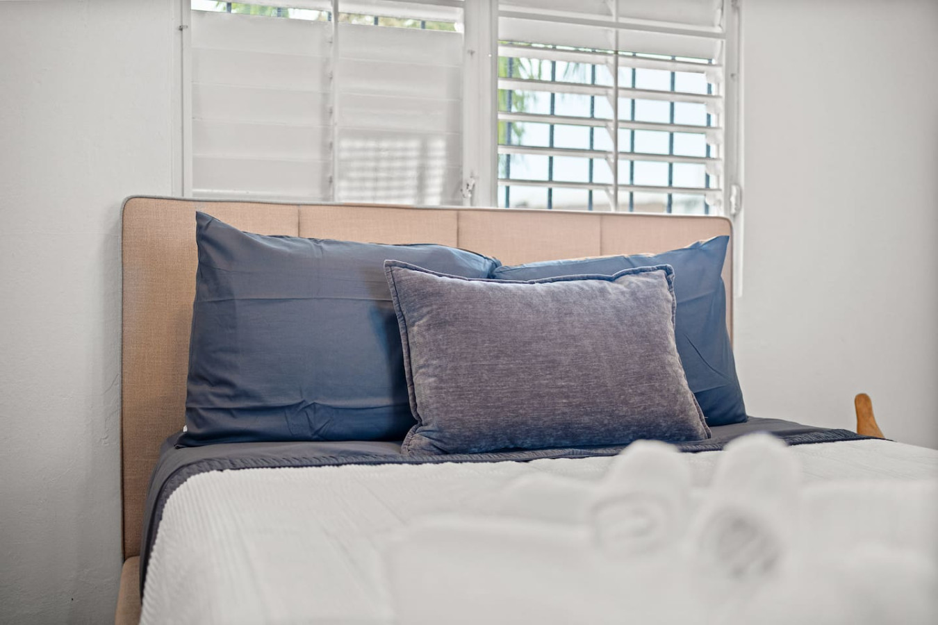 Bedroom with a blue bedspread and pillows — Sunkiss in puerto Rico San Juan 3 Bedroom, Santurce