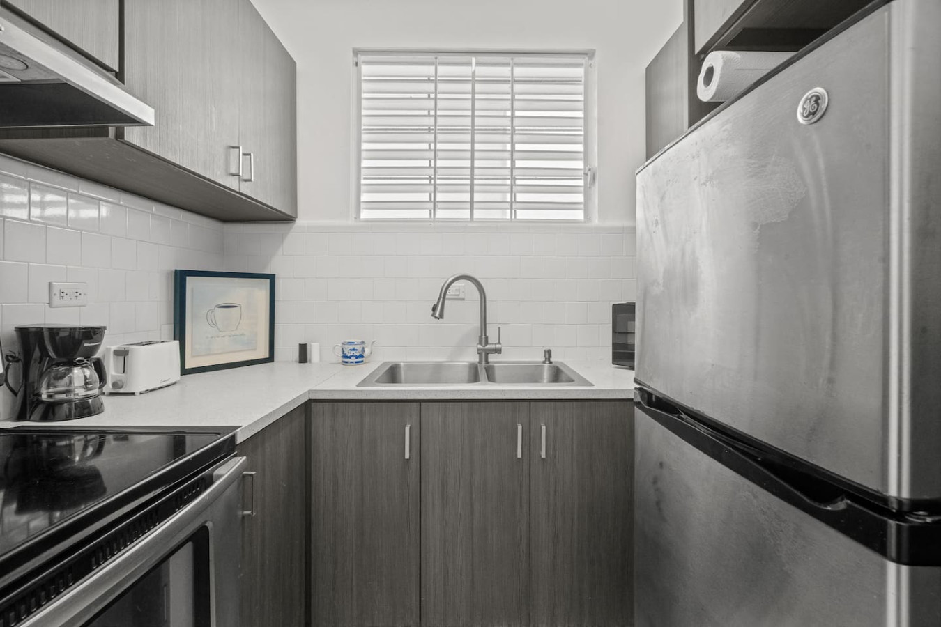 Kitchen with a sink and a picture on the wall — Sunkiss in Puerto Rico San Juan 3 Bedroom, Santurce