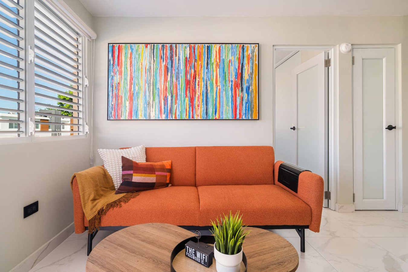 View of the ocean from the balcony of a vacation rental property in (bedroom 3) — SunJoy Modern 2BR Apartment Isla Verde, Car
