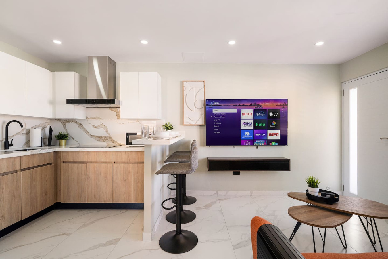 Kitchen with a large island and a stainless steel refrigerator — SunJoy Modern 2BR Apartment Isla Verde, Carolina