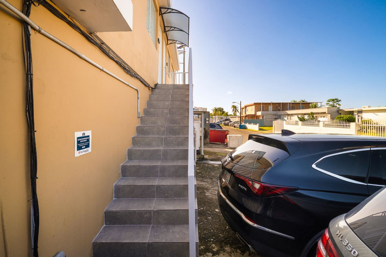 Black car is parked in front of a building — MoonJoy Chic 2BR Apartment Private Patio, Carolina