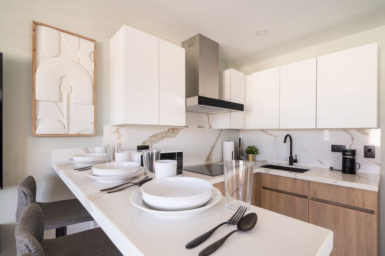 Kitchen with a stove, sink, and countertops — MoonJoy Chic 2BR Apartment Private Patio, Carolina