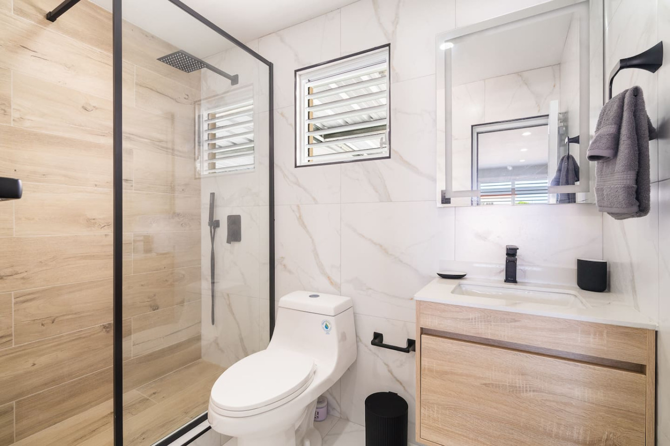Bathroom with a walk-in glass shower and a wood vanity — MoonJoy Chic 2BR Apartment Private Patio, Carolina