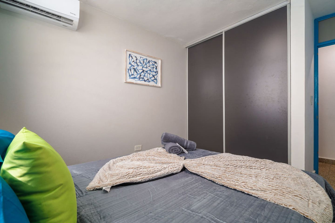 Bedroom with a grey bedspread and a sliding-door closet — Walking to the Beach 3 bedroom House Next to Ocean, Luquillo