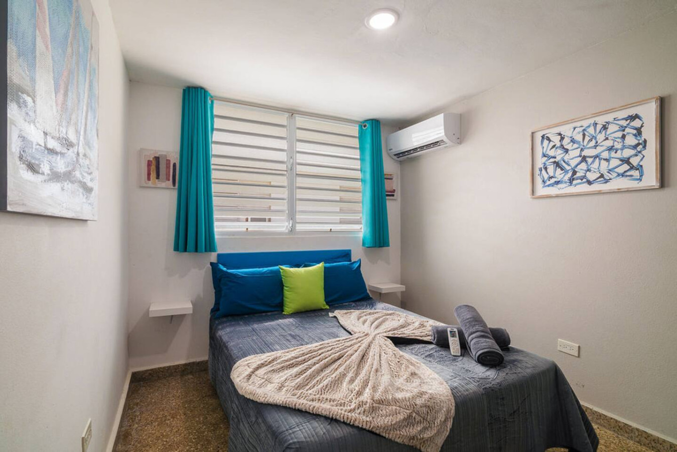 Bedroom with a blue bedspread and a white blanket — Walking to the Beach 3 bedroom House Next to Ocean, Luquillo