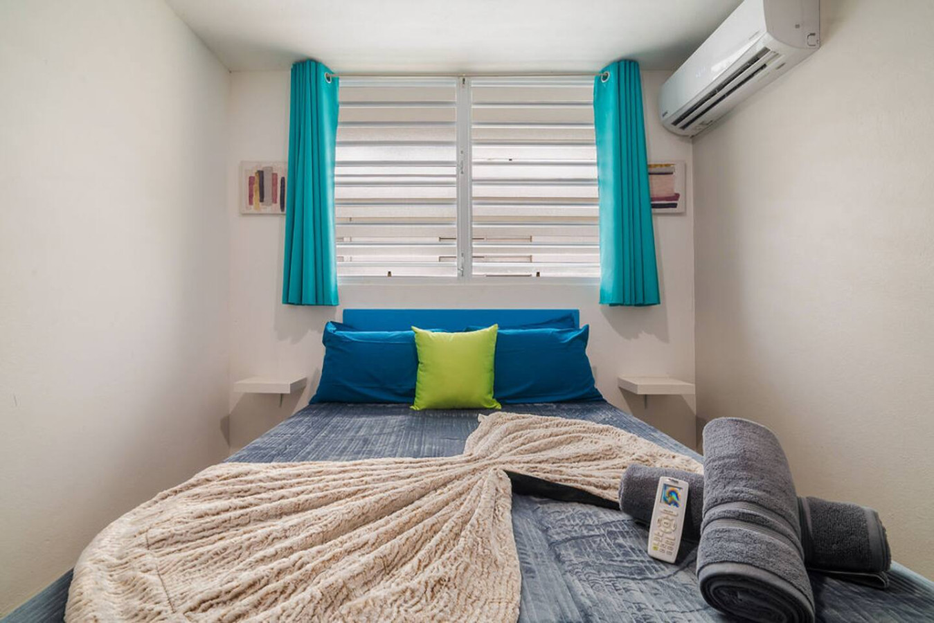 Bedroom with a blue bedspread and a white rug — Walking to the Beach 3 bedroom House Next to Ocean, Luquillo