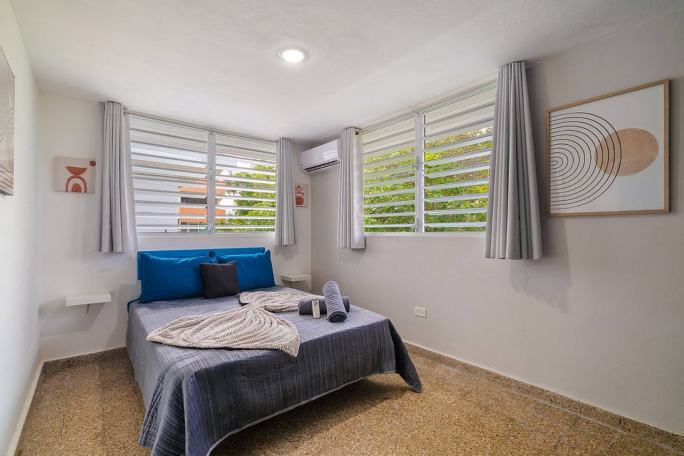 Bedroom with a blue bedspread and a view of the ocean — Walking to the Beach 3 bedroom House Next to Ocean, Luquillo