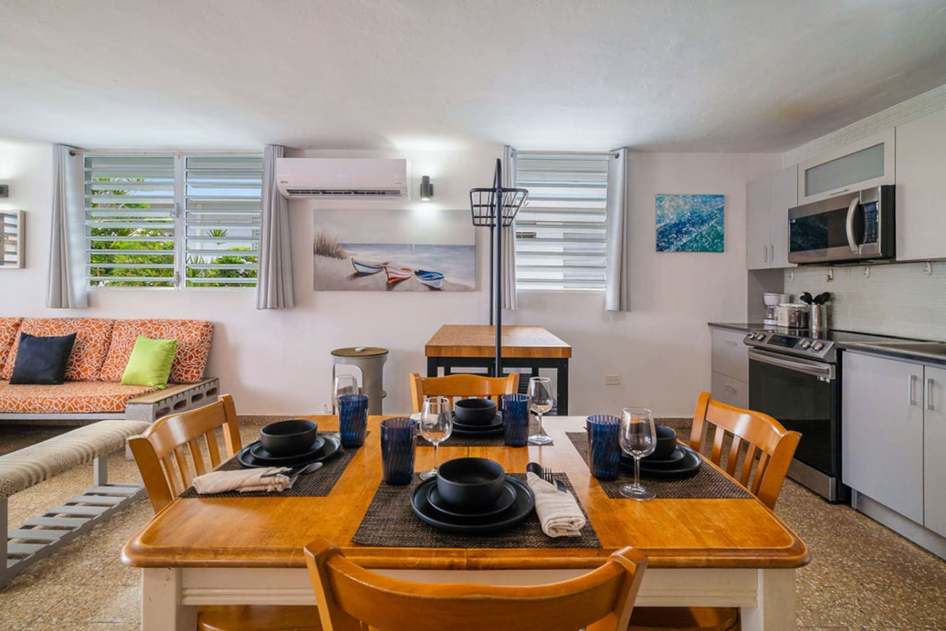 Table set for dinner with wine glasses and plates — Walking to the Beach 3 bedroom House Next to Ocean, Luquillo