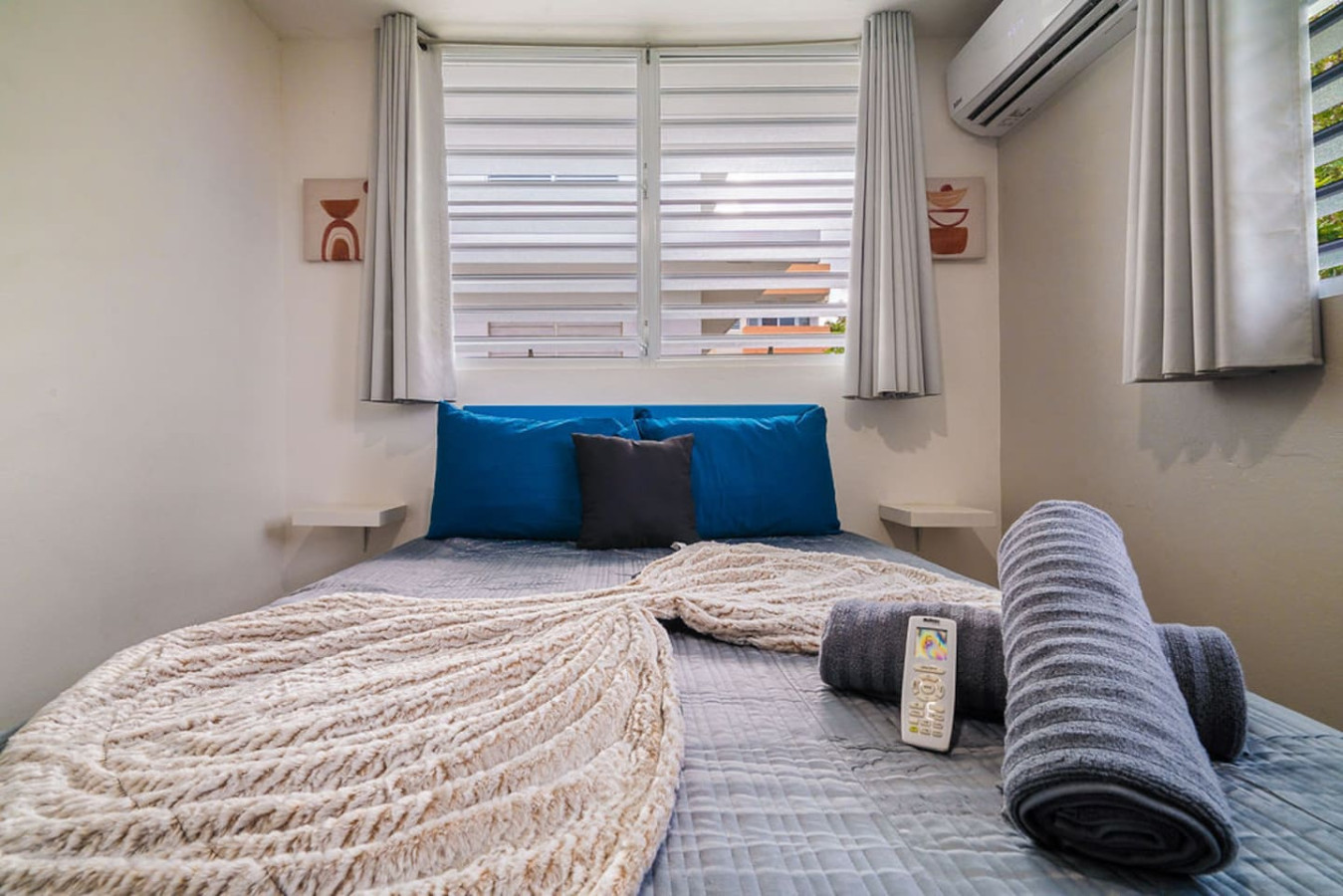 Bedroom with a blue bedspread and white sheets — Walking to the Beach 3 bedroom House Next to Ocean, Luquillo