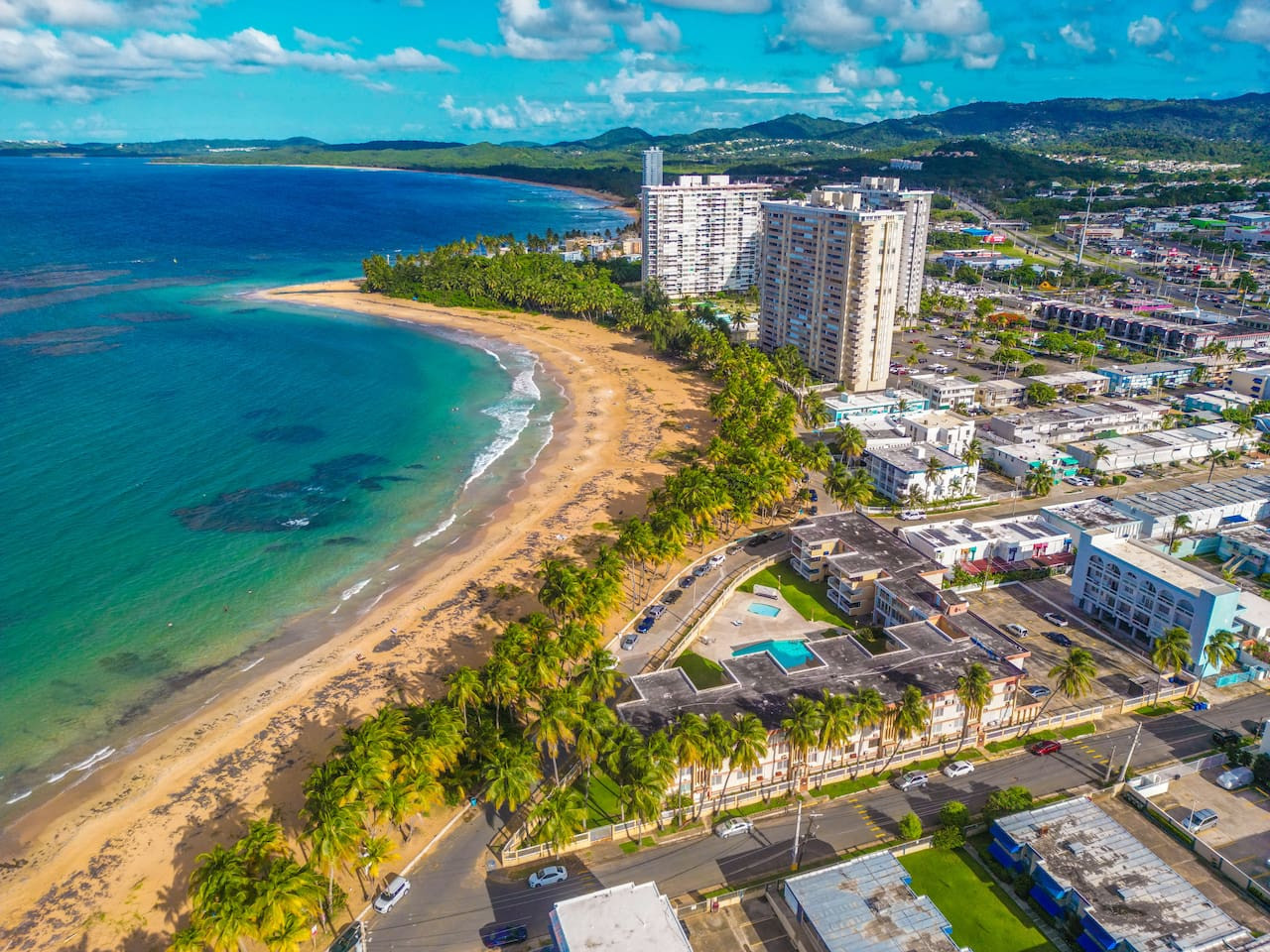 View of the beach from the balcony of a vacation rental — Walking to the Beach 3 bedroom House Next to Ocean, Luquillo