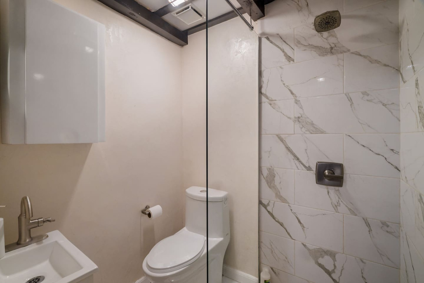 White toilet in a bathroom with a glass door — Il Rifugio Nascosto | Somewhere In Heaven, Old San Juan