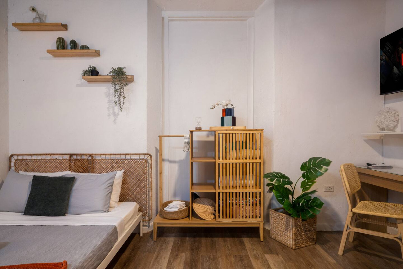 Bedroom with a bed, a nightstand, and a potted plant — Il Rifugio Nascosto | Somewhere In Heaven, Old San Juan
