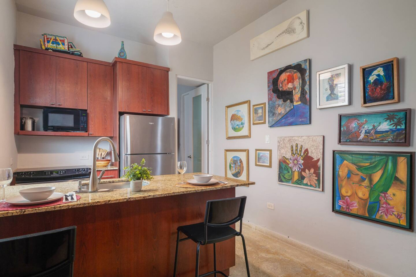 Kitchen with a refrigerator, a sink, a dining table, a chair — Historical Old SanJuan Spanish style private Patio, San Juan