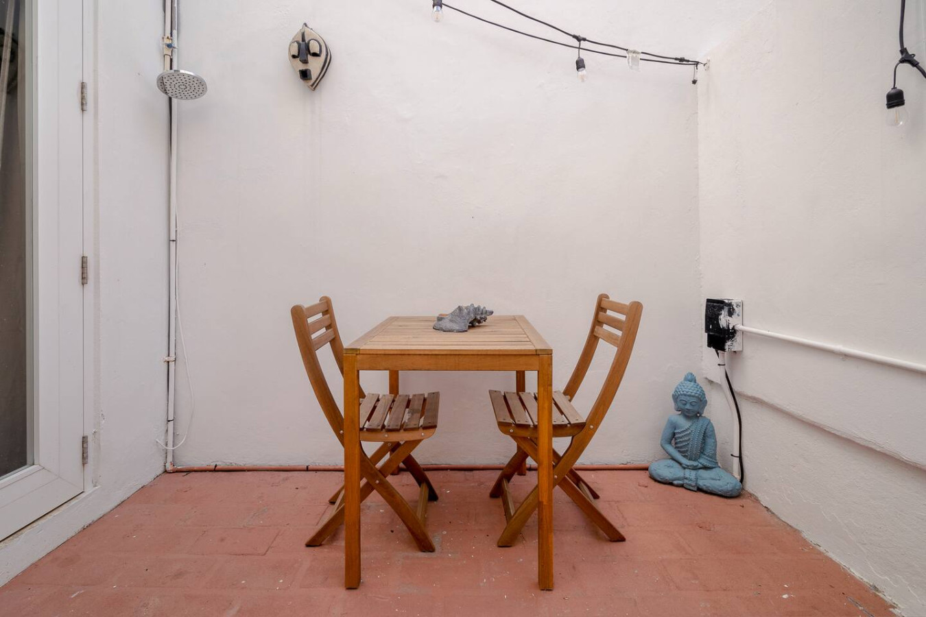 Wooden dining table with chairs in a vacation rental property — Historical Old SanJuan Spanish style private Patio, San Juan