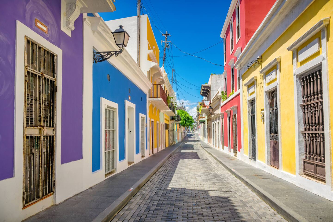 Narrow street with colorful buildings on both sides — La Cueva Loft Rustic Colonial Romance, Old San Juan