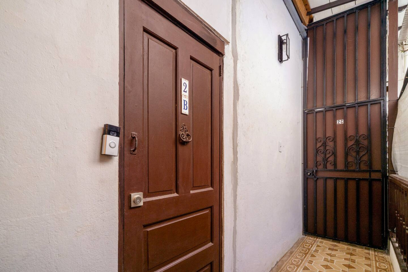 Brown wooden door with a number 2 on it — La Cueva Loft Rustic Colonial Romance, Old San Juan