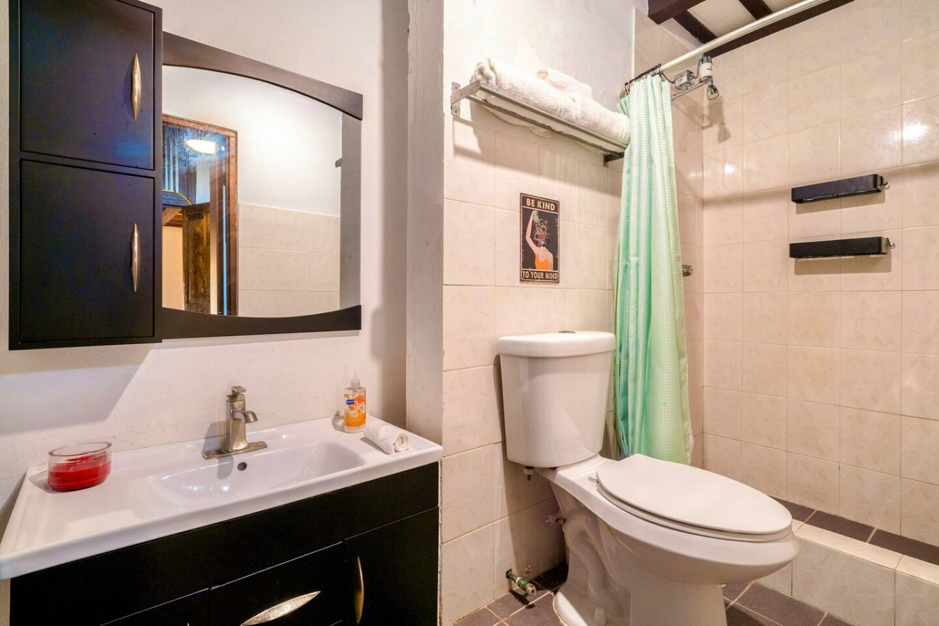 Bathroom with a toilet, sink, and mirror — La Cueva Loft Rustic Colonial Romance, Old San Juan