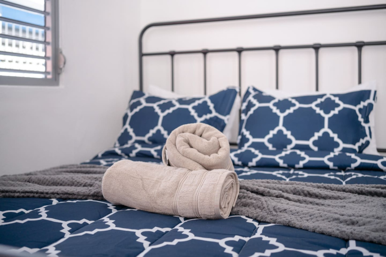 Bedroom with a bed and a towel on it — Casa Juno Grand Modern - 3 Bedroom - Walk to Beach, Santurce