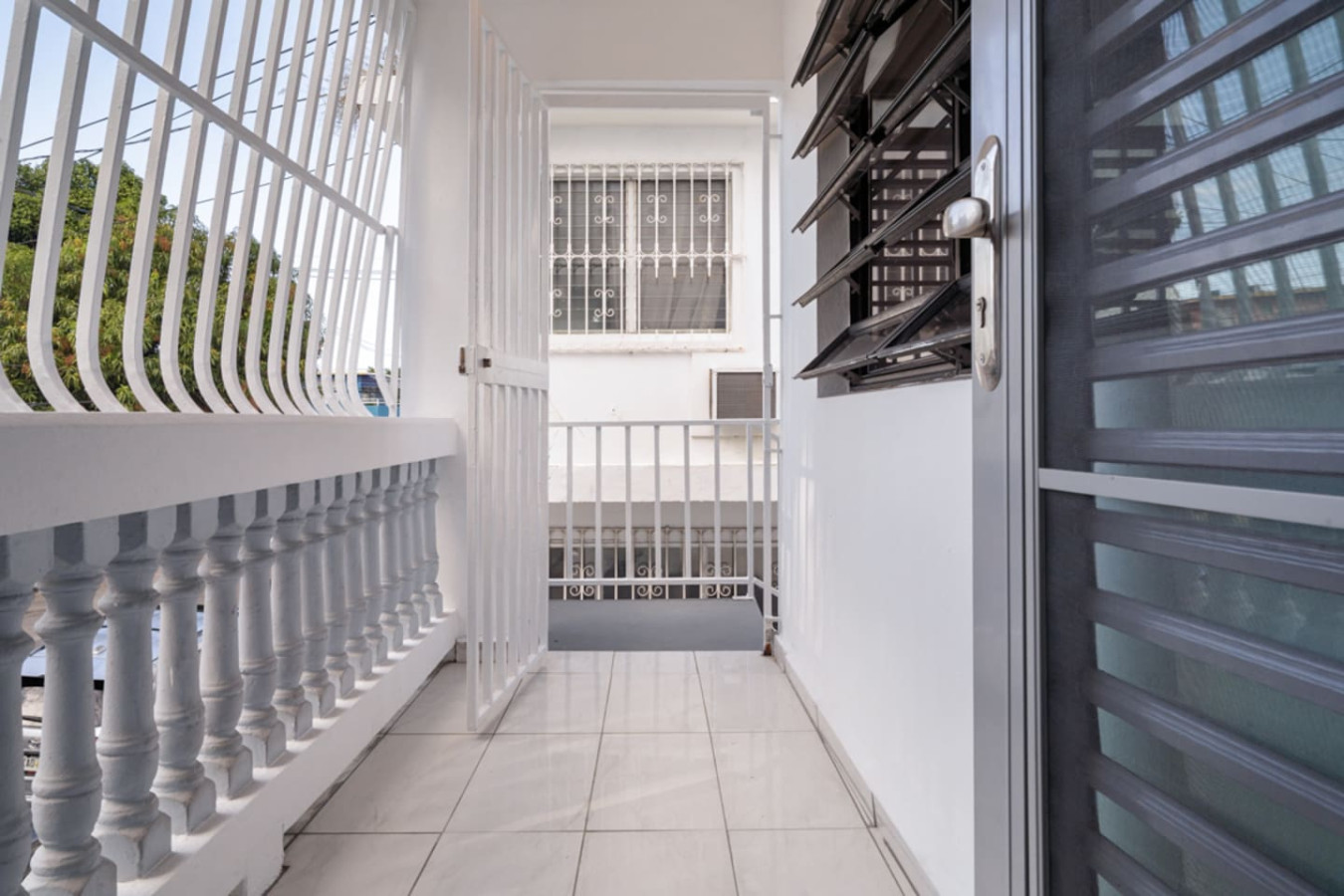 Balcony walkway with white balusters — Casa Juno Grand Modern - 3 Bedroom - Walk to Beach, Santurce