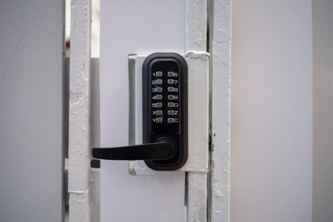 Entrance gate's push-button keypad lock — Casa Juno Grand Modern - 3 Bedroom - Walk to Beach, Santurce