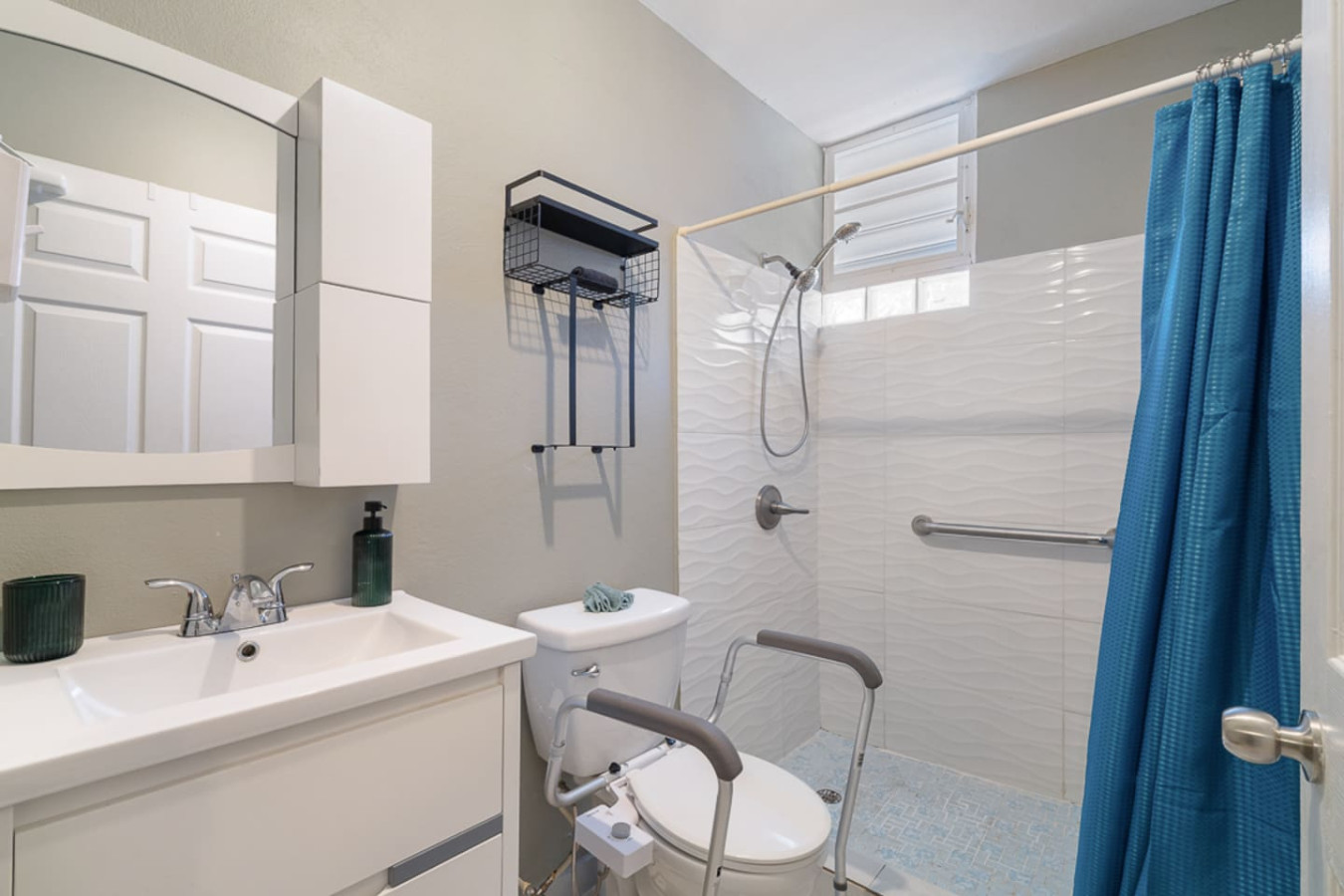 White bathroom with a toilet and sink — Casa Juno I: Private Courtyard Studio, Santurce