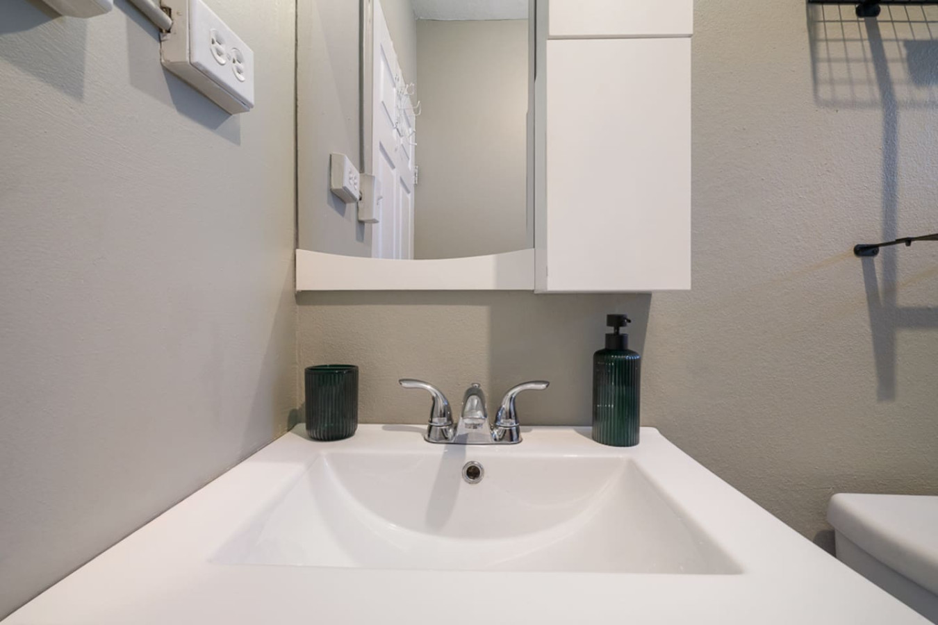 Bathroom vanity sink with a soap dispenser — Casa Juno I: Private Courtyard Studio, Santurce