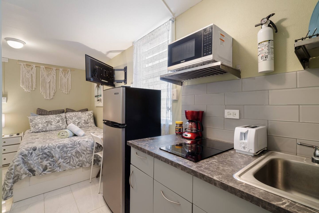 Kitchen with a refrigerator, microwave, and oven — Romero Studio San juan near beach, Santurce