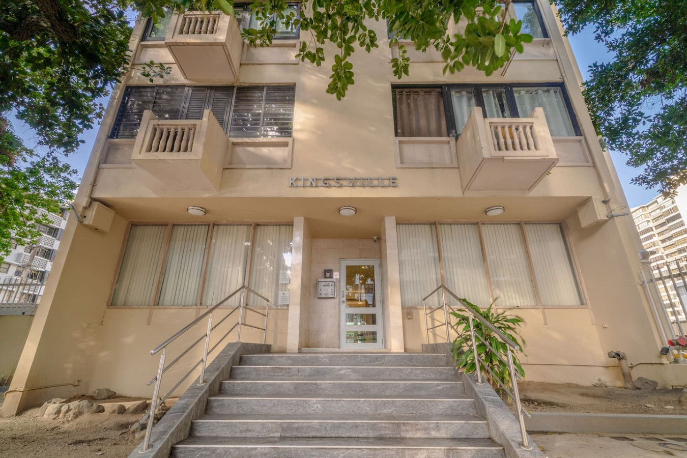 Building entrance up a flight of steps — Luxe Beachside Oasis: Pool Parking & Generator, Santurce