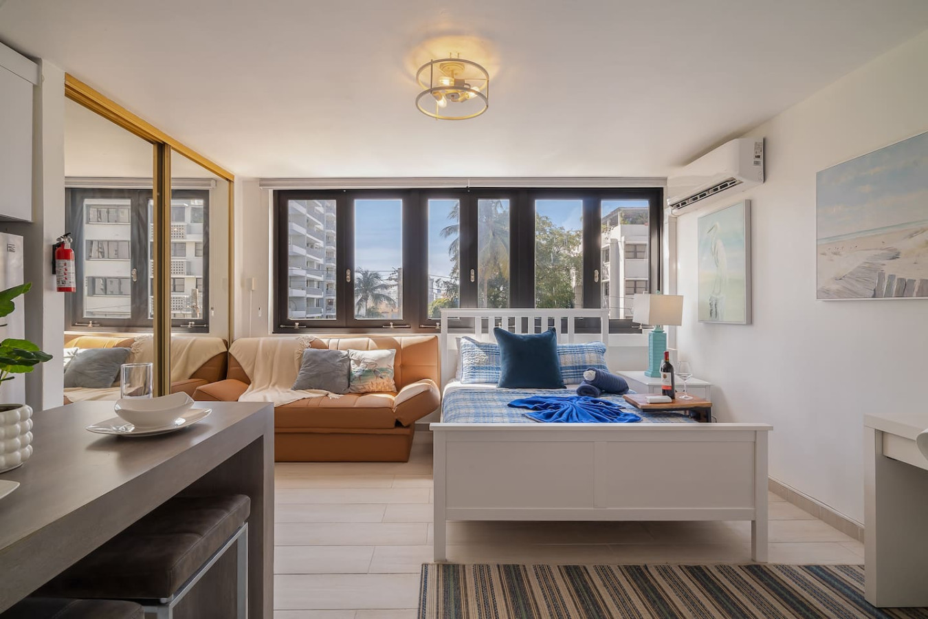 Bedroom with a bed, couch, and chair — Luxe Beachside Oasis: Pool Parking & Generator, Santurce