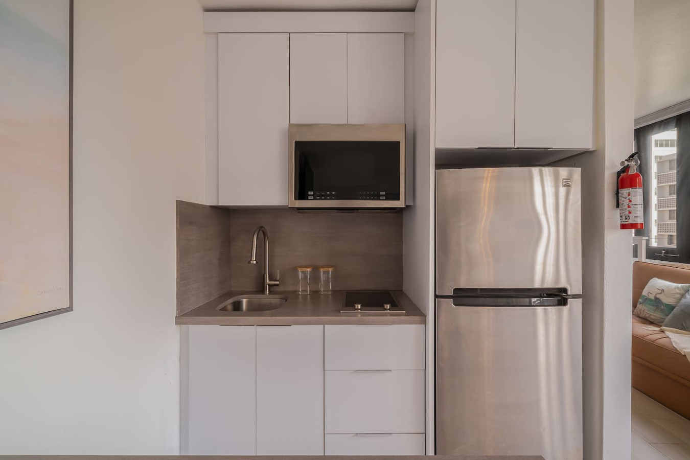 Kitchen with a microwave and a sink — Luxe Beachside Oasis: Pool Parking & Generator, Santurce