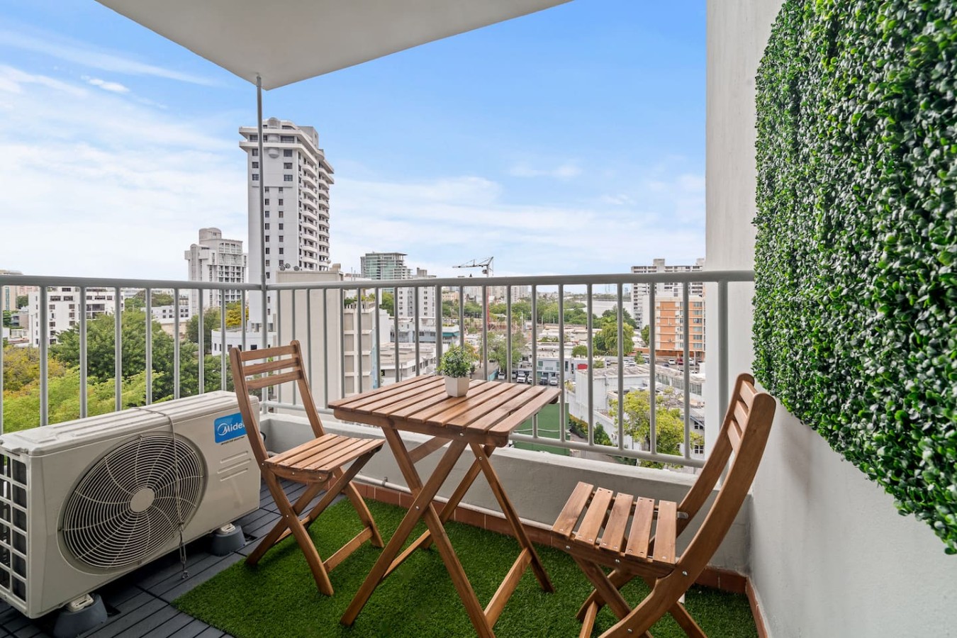 Balcony overlooking a city — High-Rise Condado Suite | Ocean Views & PR Skyline, Condado