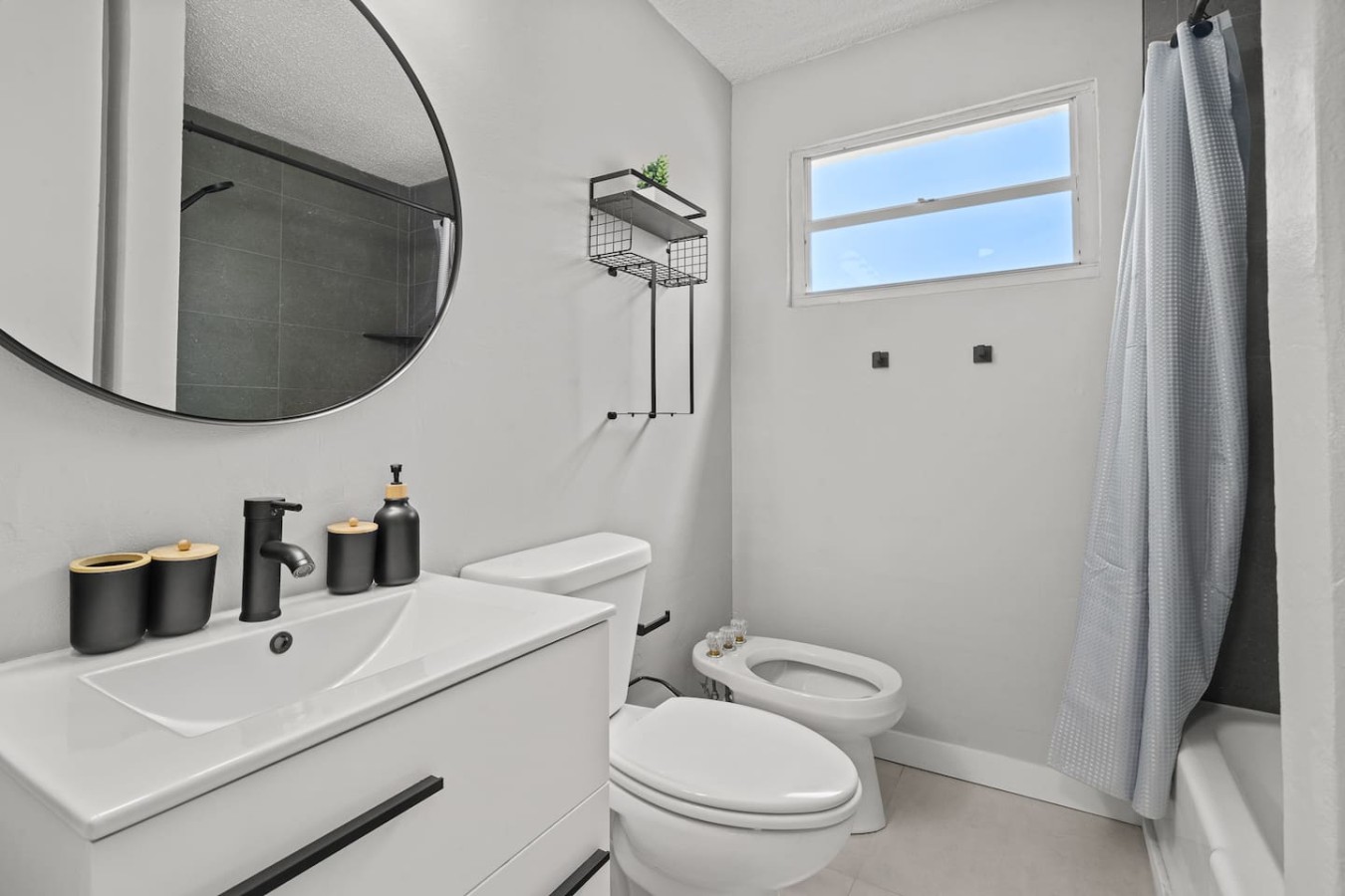 White toilet in a bathroom — High-Rise Condado Suite | Ocean Views & PR Skyline