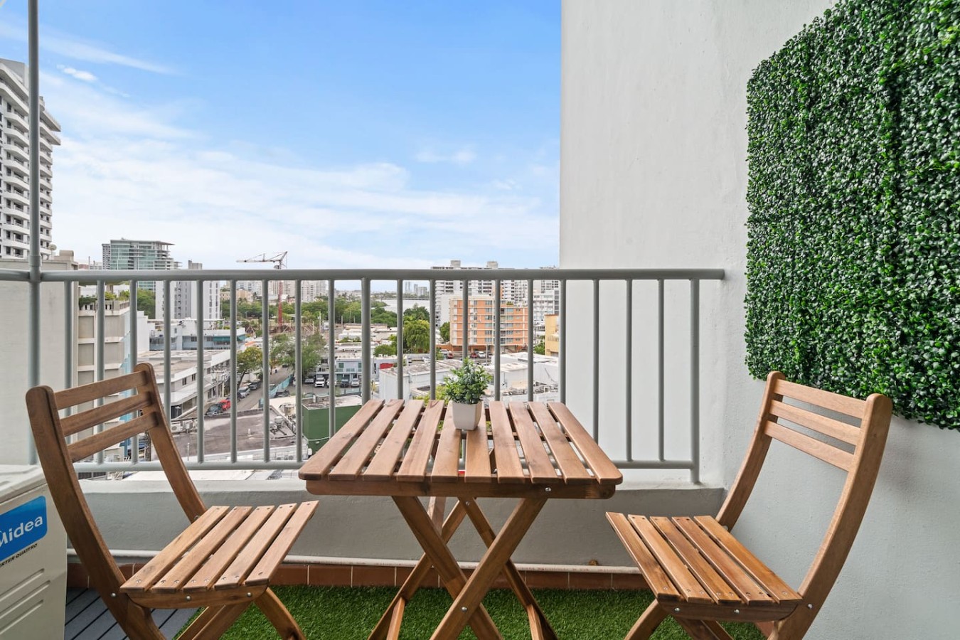 Balcony overlooking the city — High-Rise Condado Suite | Ocean Views & PR Skyline, Condado