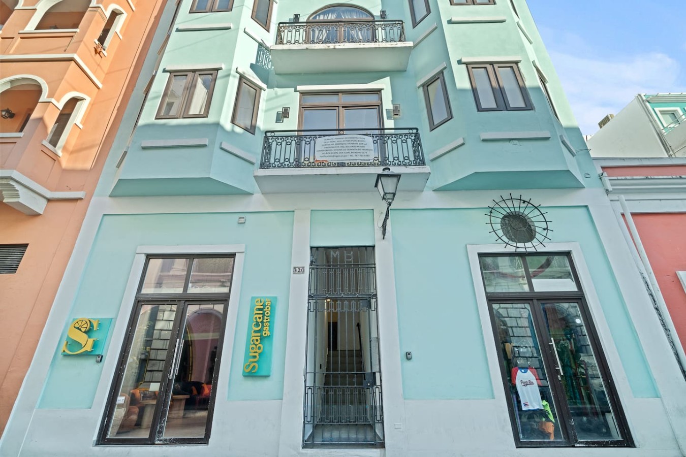Blue and white building with a balcony — The Galleria House | Private Patio Old San Juan, Old San Juan