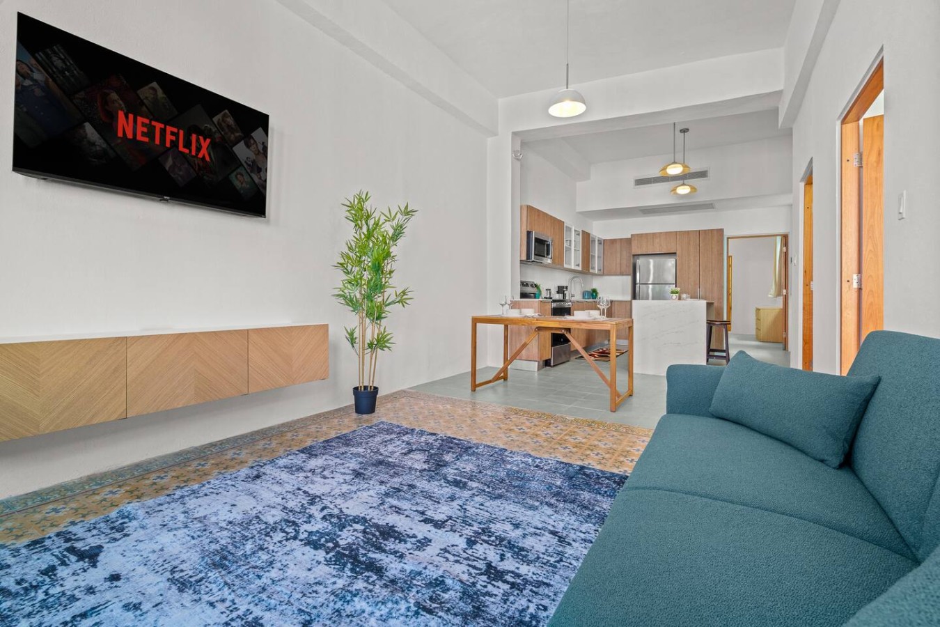 Living room with a couch and a TV — The Galleria House | Private Patio Old San Juan, Old San Juan