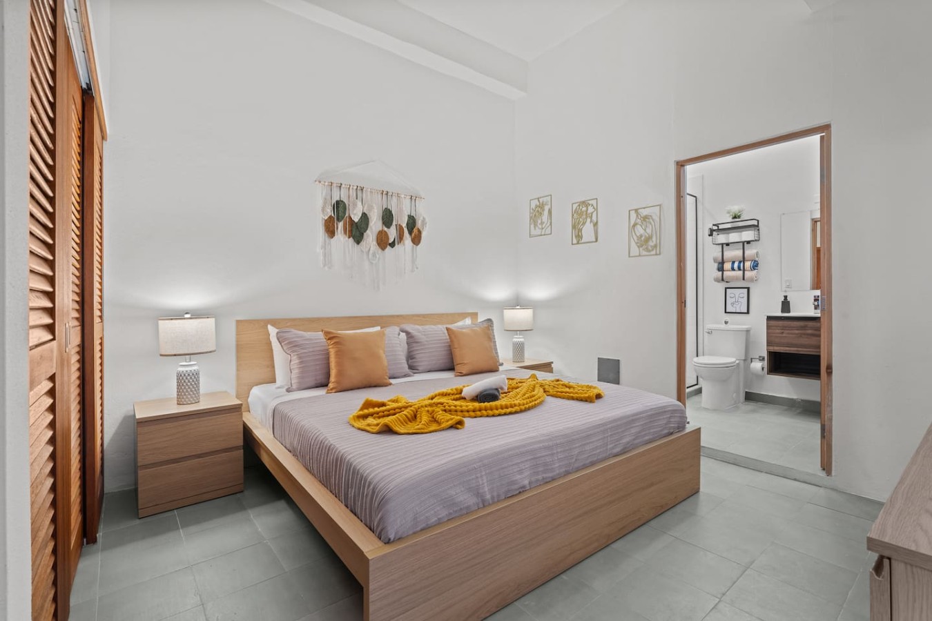 Bedroom with a bed and a yellow blanket on it (bedroom 2) — The Galleria House | Private Patio Old San Juan, Old San Juan