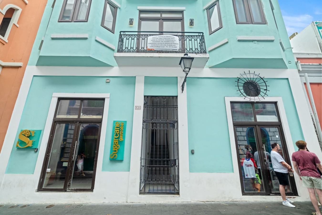 Blue and white building with a green sign on the front — Bellavista Galleria | Old San Juan, Old San Juan