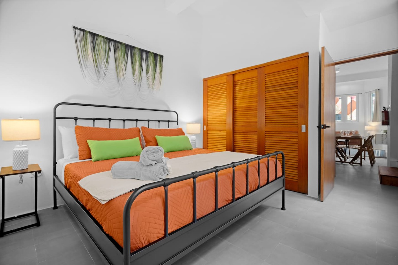 Bedroom with a bed, nightstand, and a painting on the wall — Bellavista Galleria | Old San Juan, Old San Juan