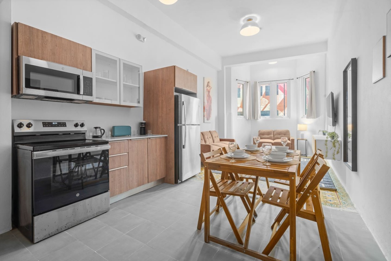 Kitchen with a refrigerator, microwave, and oven — Bellavista Galleria | Old San Juan