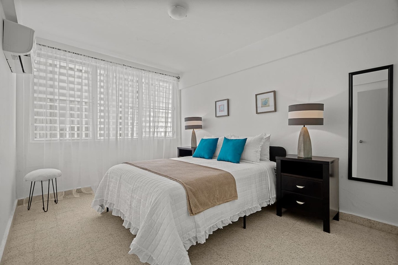 Bedroom with a bed and a lamp on a nightstand — Ocean Park 2BR Backyard BBQ Walk to Beach, Santurce