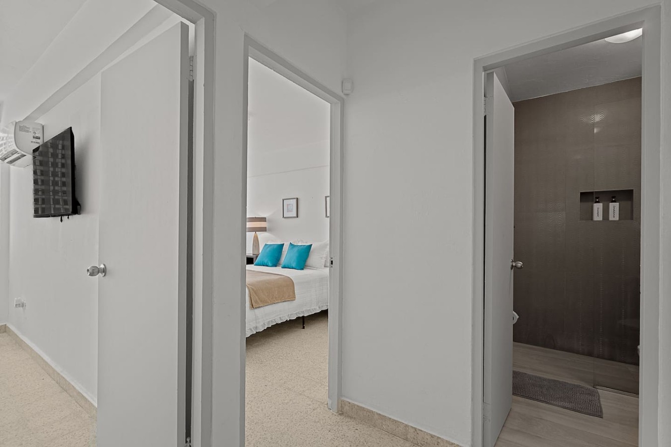 Hallway with doors to a bedroom and the bathroom — Ocean Park 2BR Backyard BBQ Walk to Beach, Santurce