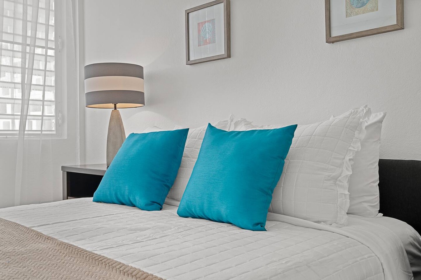 Two blue pillows on a white bed — Ocean Park 2BR Backyard BBQ Walk to Beach, Santurce