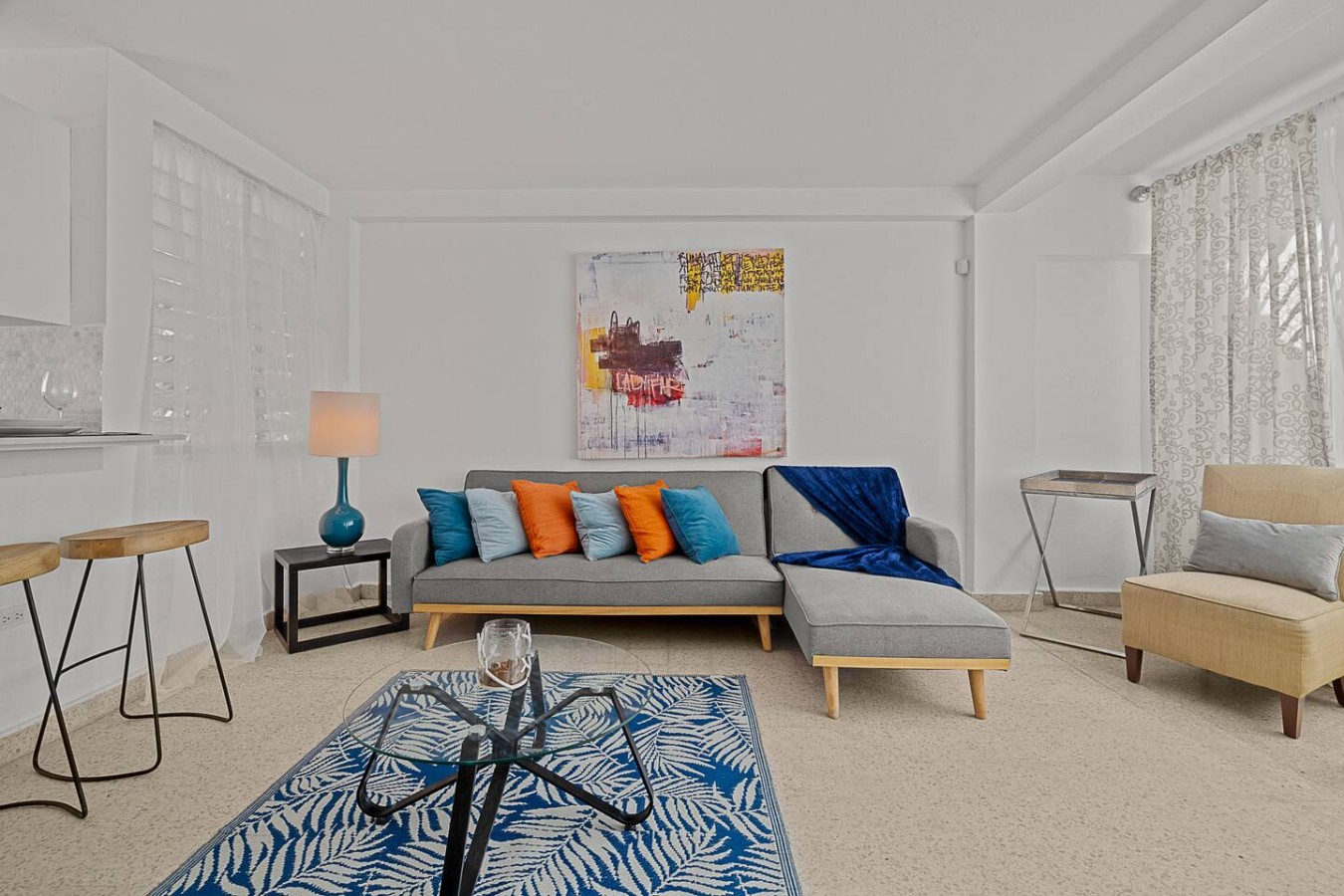 Living room with a sectional sofa and bar stools — Ocean Park 2BR Backyard BBQ Walk to Beach, Santurce
