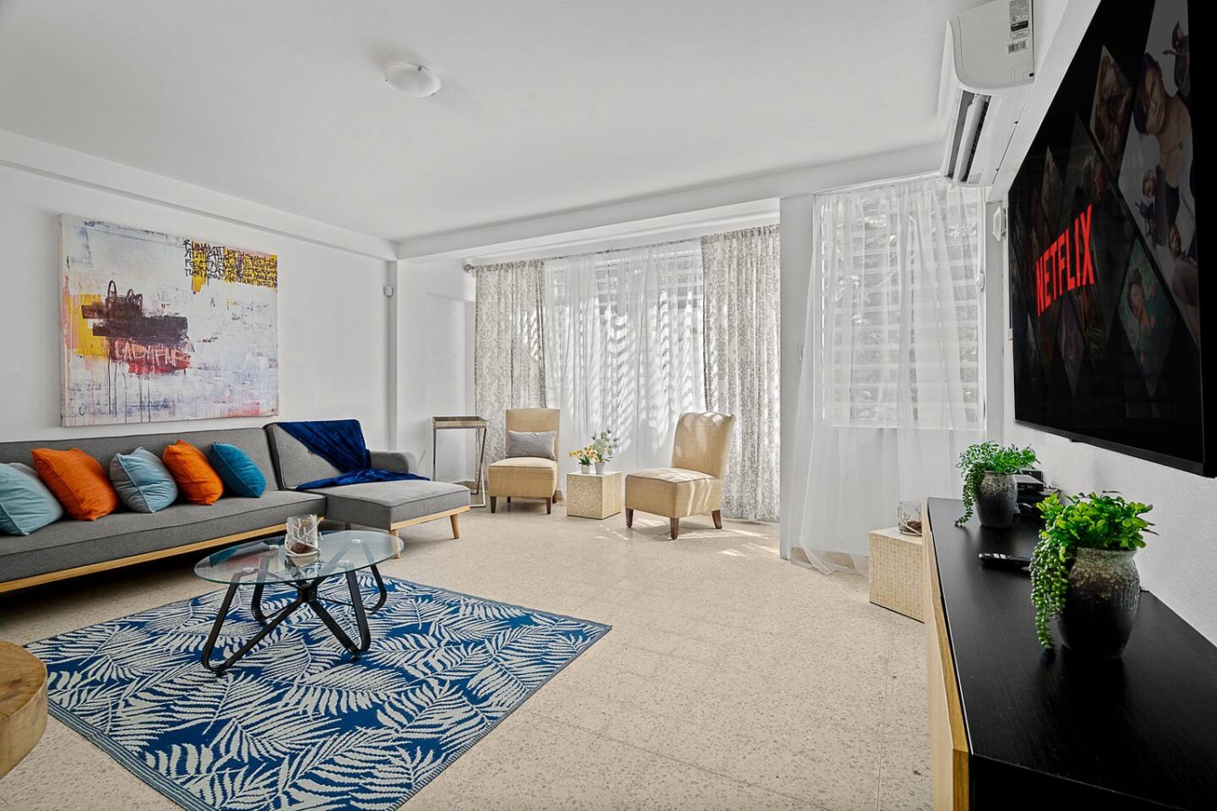 Living room with a couch, chairs, and a rug — Ocean Park 2BR Backyard BBQ Walk to Beach, Santurce
