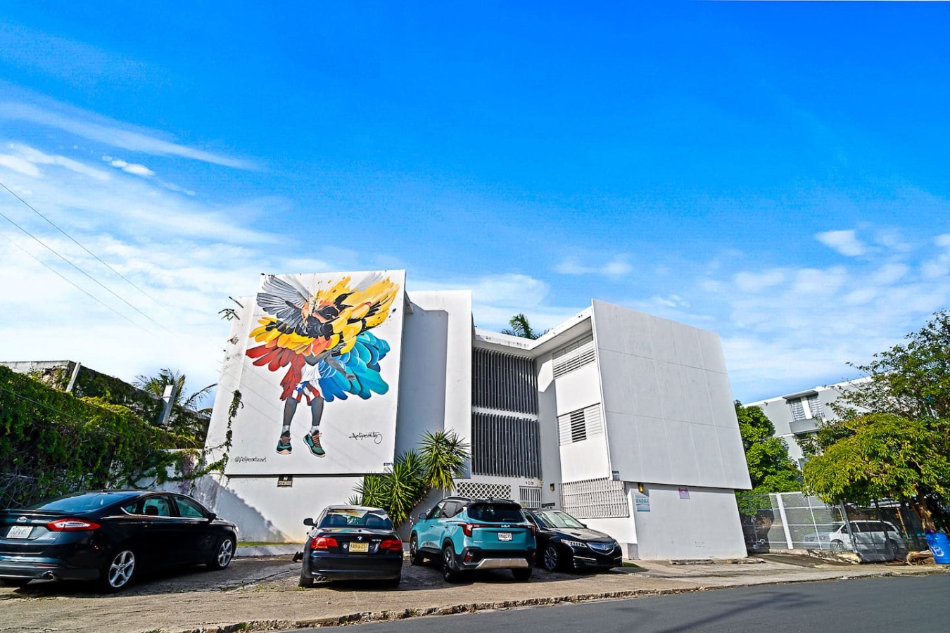 Colorful mural on the side of a building — Ocean Park 2BR Backyard BBQ Walk to Beach, Santurce