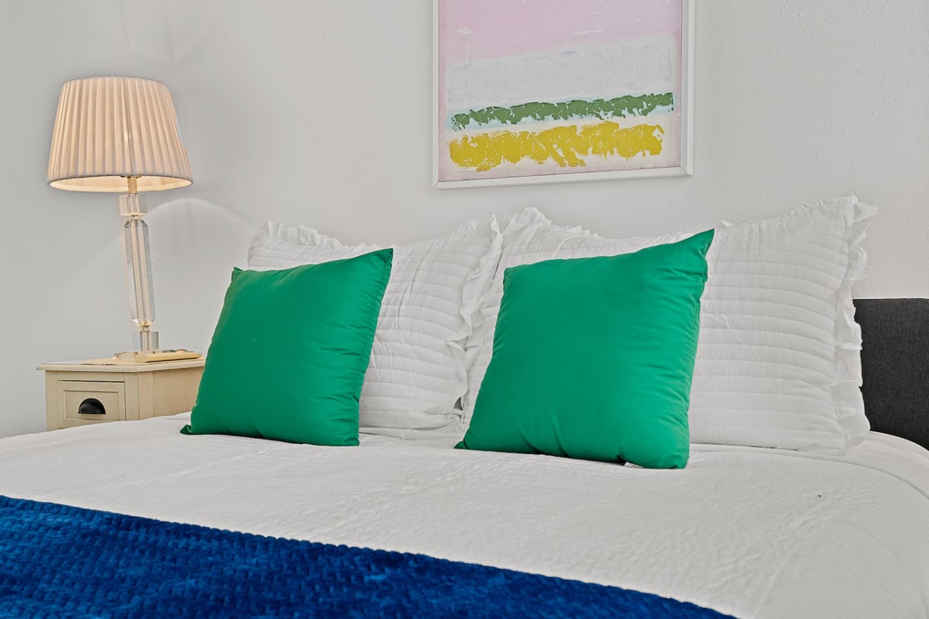 Two green pillows on a white bed — Ocean Park 2BR Backyard BBQ Walk to Beach, Santurce