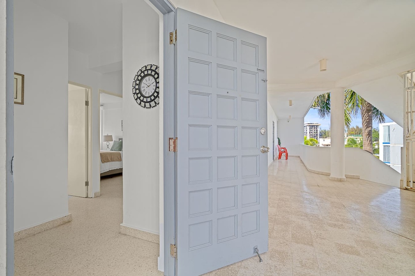 Front door opening onto the building's open walkway — Ocean Park 2BR · Steps to Beach & Dining, Santurce