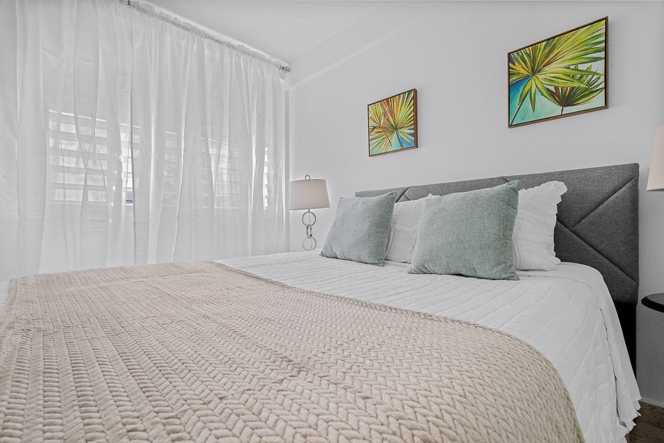Bedroom with a white bedspread and two pillows (bedroom 2) — Ocean Park 2BR · Steps to Beach & Dining, Santurce