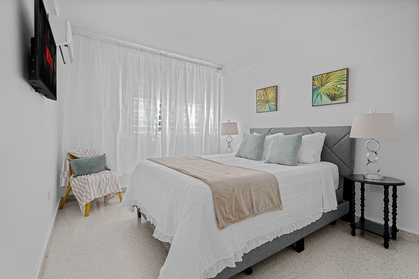 Bedroom with a bed and a chair — Ocean Park 2BR · Steps to Beach & Dining, Santurce